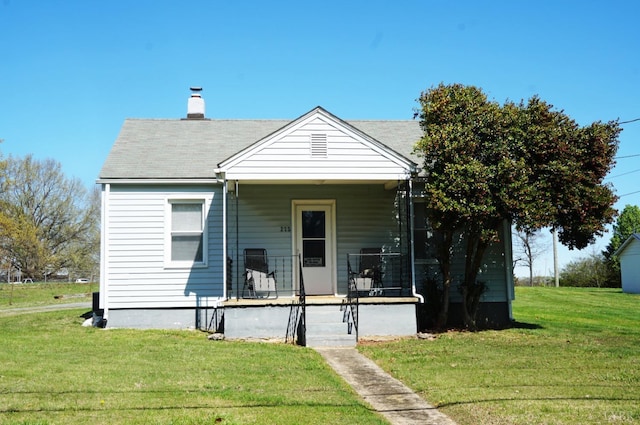 272 Jasper Wood Rd, Hurt, VA 24563 - bungalow featuring a porch, a chimney, and a front lawn