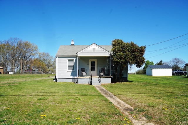 272 Jasper Wood Rd, Hurt, VA 24563 - view of front facade featuring a front yard, a chimney, and covered porch