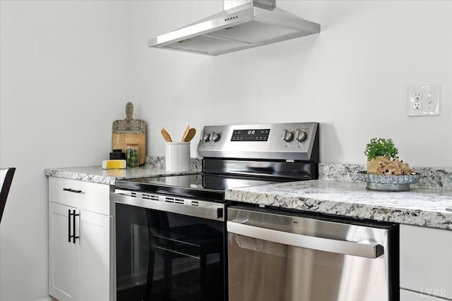 109 Ned Brown Rd, Amherst, VA 24521 - kitchen featuring appliances with stainless steel finishes, exhaust hood, white cabinets, and light stone counters
