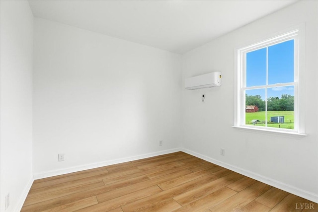 109 Ned Brown Rd, Amherst, VA 24521 - spare room with a wall unit AC and light wood-type flooring