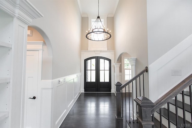 14 Deer Hollow Rd, Forest, VA 24551 - foyer entrance with an inviting chandelier, dark wood finished floors, arched walkways, ornamental molding, and french doors