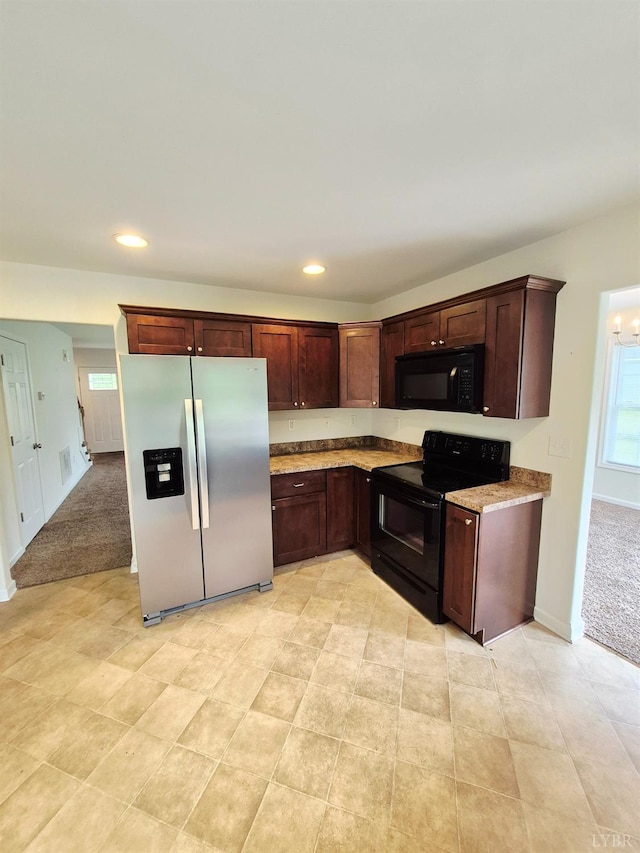 188 Oak Spring Ln, Madison Heights, VA 24572 - kitchen with black appliances, recessed lighting, dark brown cabinetry, light carpet, and light stone countertops