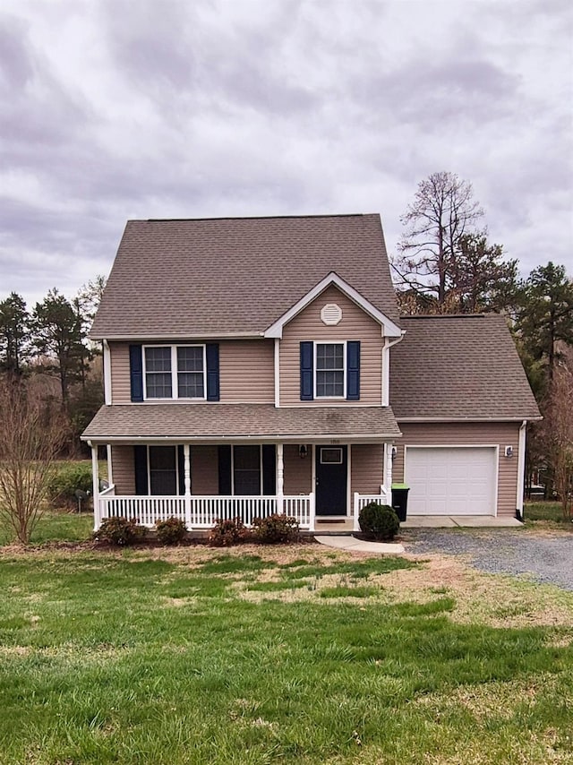 188 Oak Spring Ln, Madison Heights, VA 24572 - view of front facade with a porch, driveway, a garage, and a front yard