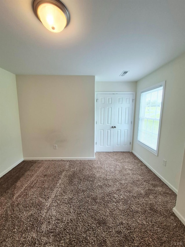 188 Oak Spring Ln, Madison Heights, VA 24572 - unfurnished bedroom featuring carpet and a closet