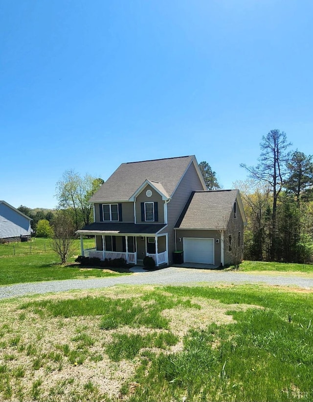 188 Oak Spring Ln, Madison Heights, VA 24572 - view of front facade featuring covered porch, gravel driveway, a garage, and a front lawn