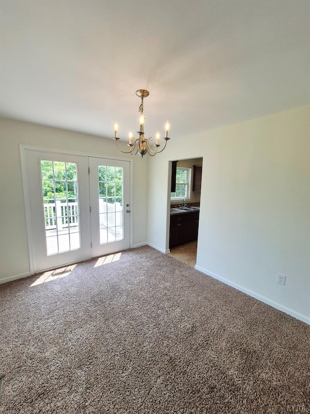 188 Oak Spring Ln, Madison Heights, VA 24572 - unfurnished room with a chandelier and light carpet