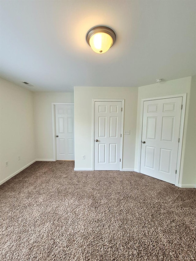 188 Oak Spring Ln, Madison Heights, VA 24572 - unfurnished bedroom with baseboards and carpet floors