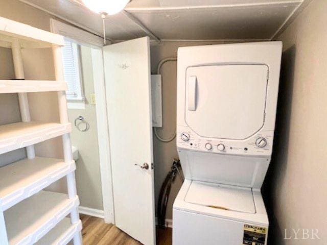 2024 Poplar St, Lynchburg, VA 24504 - washroom featuring stacked washer / dryer and wood finished floors