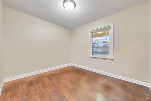 1048 Grove Ln, Roanoke, VA 24012 - unfurnished room with wood finished floors and baseboards