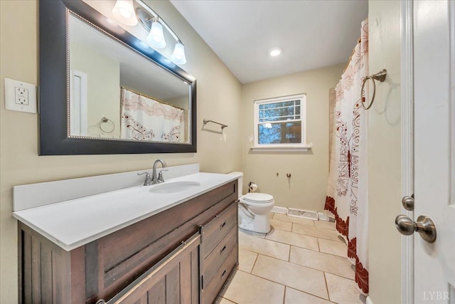 1048 Grove Ln, Roanoke, VA 24012 - bathroom featuring vanity, toilet, tile patterned floors, and baseboards