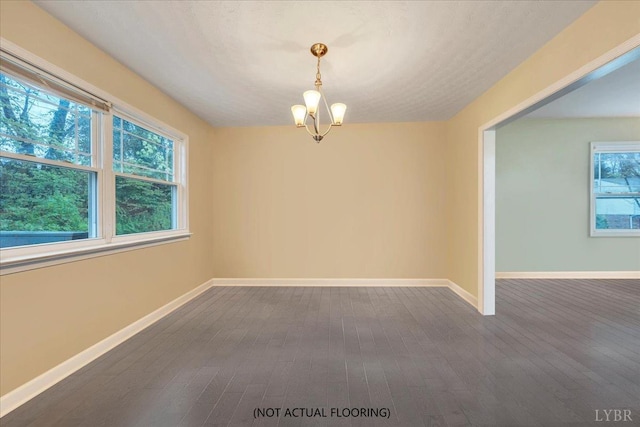 1048 Grove Ln, Roanoke, VA 24012 - spare room featuring dark wood-style floors, a chandelier, and baseboards