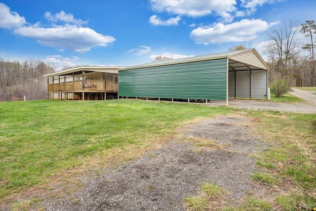 garage featuring a carport and driveway