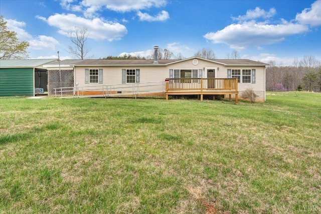 rear view of house with a yard, a wooden deck, and crawl space