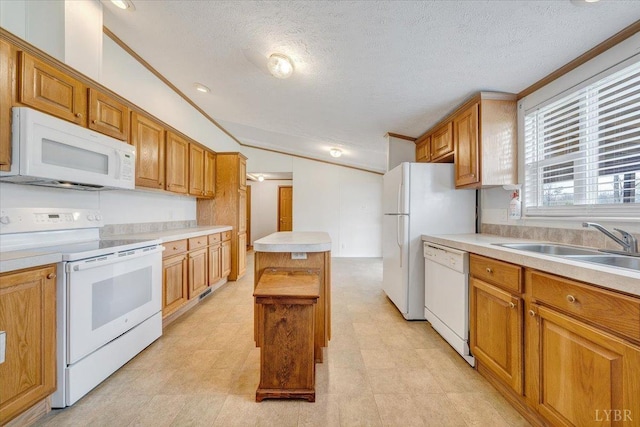 kitchen featuring a sink, light countertops, white appliances, a textured ceiling, and lofted ceiling