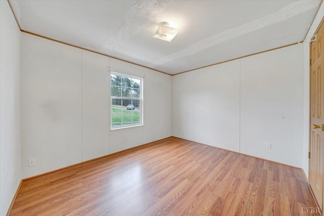 unfurnished room with light wood finished floors