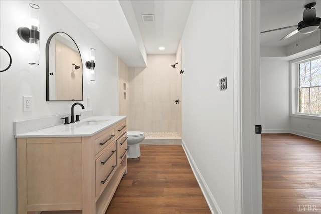1148 Val Ter, Forest, VA 24551 - bathroom with toilet, tiled shower, vanity, and wood finished floors