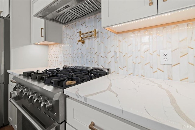 1148 Val Ter, Forest, VA 24551 - kitchen with backsplash, light stone countertops, premium range hood, and stainless steel appliances