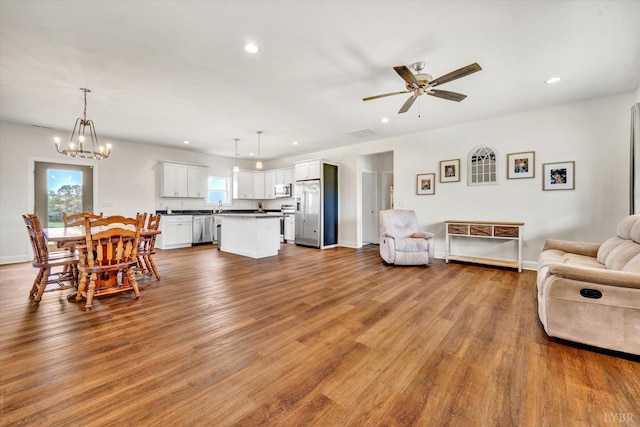 664 Collins Ferry Rd, Gladys, VA 24554 - living area featuring ceiling fan, wood finished floors, recessed lighting, a chandelier, and baseboards