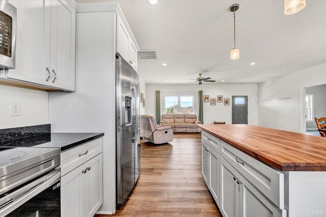 664 Collins Ferry Rd, Gladys, VA 24554 - kitchen with wooden counters, appliances with stainless steel finishes, open floor plan, light wood-style floors, and recessed lighting