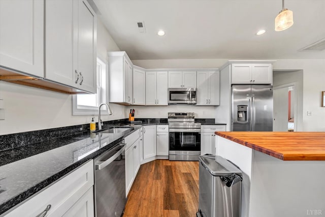 664 Collins Ferry Rd, Gladys, VA 24554 - kitchen featuring stainless steel appliances, a sink, butcher block counters, white cabinets, and recessed lighting