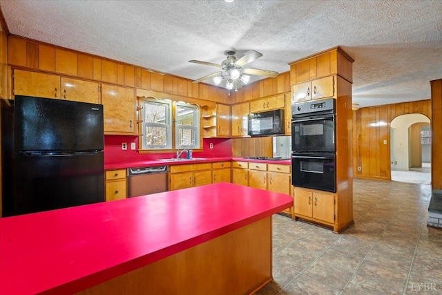 123 Knollwood Dr, Hurt, VA 24563 - kitchen featuring black appliances, arched walkways, a ceiling fan, a textured ceiling, and wooden walls