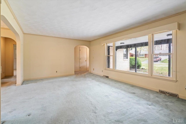 123 Knollwood Dr, Hurt, VA 24563 - carpeted spare room featuring arched walkways, baseboards, and crown molding