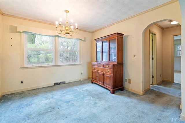 123 Knollwood Dr, Hurt, VA 24563 - unfurnished dining area featuring arched walkways, light carpet, a chandelier, ornamental molding, and baseboards
