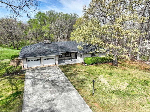 123 Knollwood Dr, Hurt, VA 24563 - view of front of home with driveway, a front yard, an attached garage, and a chimney