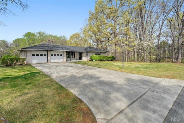 123 Knollwood Dr, Hurt, VA 24563 - view of front of property featuring a garage, concrete driveway, a chimney, and a front yard