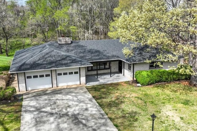 123 Knollwood Dr, Hurt, VA 24563 - view of front of home featuring concrete driveway, a garage, a front yard, brick siding, and roof with shingles