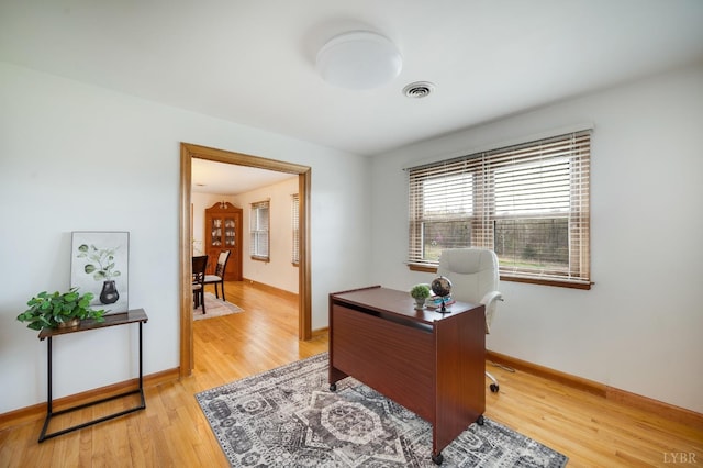 office featuring light wood finished floors and baseboards