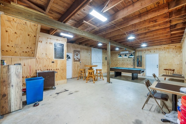 game room with unfinished concrete flooring and pool table