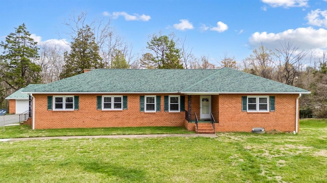 ranch-style home with brick siding, a shingled roof, a front lawn, and a chimney
