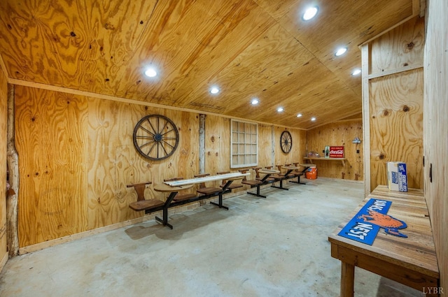 rec room with unfinished concrete floors, wood walls, wooden ceiling, lofted ceiling, and recessed lighting