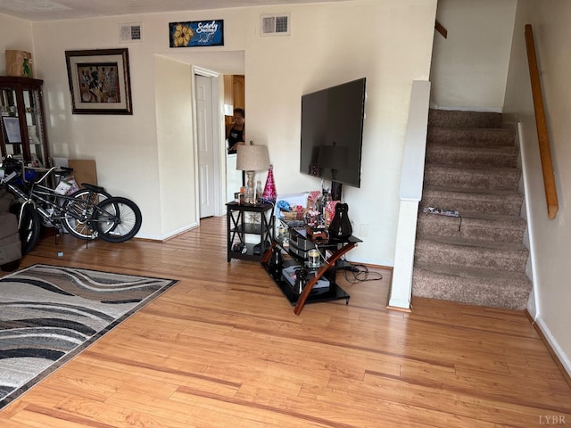 31 Westdale Dr, Lynchburg, VA 24501 - living area featuring light wood-type flooring, baseboards, visible vents, and stairway