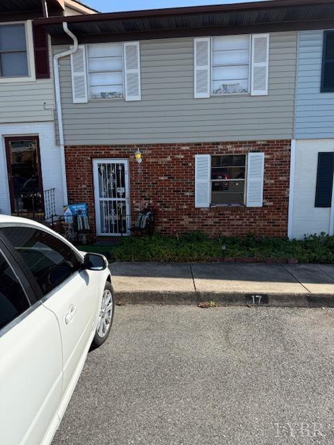 view of property with brick siding