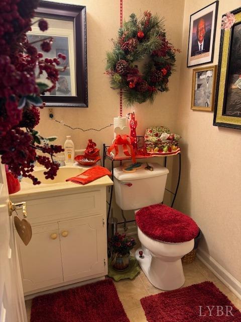 17 Westdale Dr, Lynchburg, VA 24501 - half bath with toilet, tile patterned floors, vanity, and baseboards
