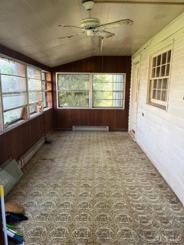 201 Charlotte Ave, Phenix, VA 23959 - unfurnished sunroom with wooden walls, a baseboard heating unit, lofted ceiling, and a baseboard radiator