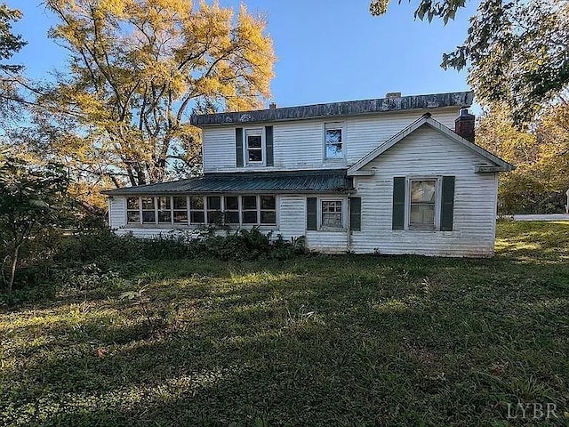 201 Charlotte Ave, Phenix, VA 23959 - back of property featuring a chimney and a yard