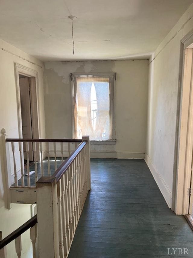 201 Charlotte Ave, Phenix, VA 23959 - corridor with an upstairs landing, dark wood-style flooring, and baseboards