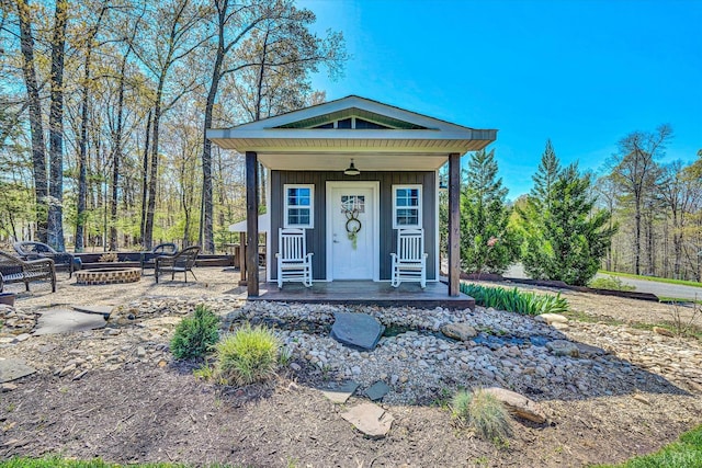 1062 Ivy Creek Dr, Forest, VA 24551 - view of front facade featuring an outdoor fire pit, a porch, and board and batten siding
