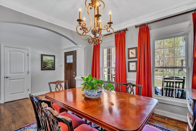 1062 Ivy Creek Dr, Forest, VA 24551 - dining area with a chandelier, arched walkways, baseboards, dark wood-style flooring, and ornate columns