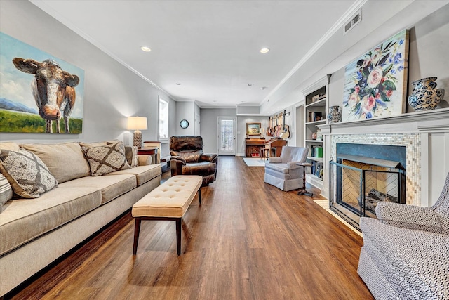 1062 Ivy Creek Dr, Forest, VA 24551 - living area featuring wood finished floors, built in shelves, a fireplace, crown molding, and recessed lighting