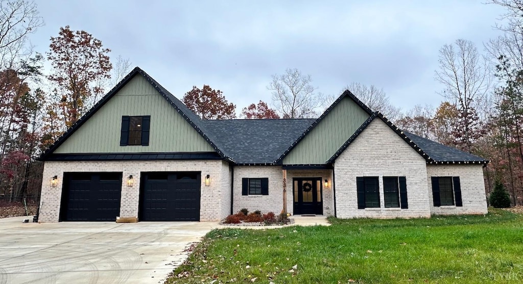 11218 Leesville Rd, Evington, VA 24550 - modern farmhouse with a front lawn, concrete driveway, a shingled roof, and brick siding