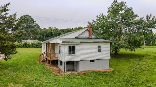 15939 Richmond Hwy, Pamplin, VA 23958 - rear view of house with a lawn, a chimney, and a metal roof