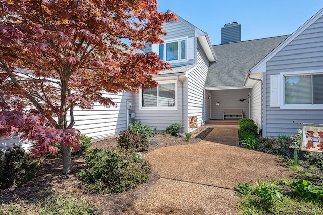 502 Fairwinds Ct, Forest, VA 24551 - view of front of house with a shingled roof and a chimney