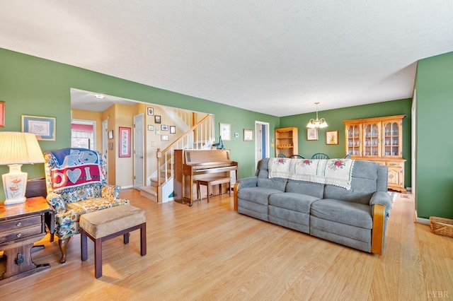 502 Fairwinds Ct, Forest, VA 24551 - living room with stairs, wood finished floors, a chandelier, and baseboards