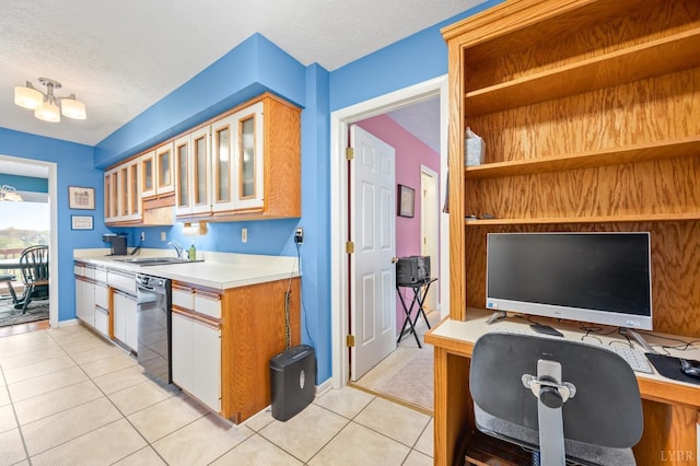 502 Fairwinds Ct, Forest, VA 24551 - kitchen with black dishwasher, a sink, light countertops, light tile patterned floors, and an office area