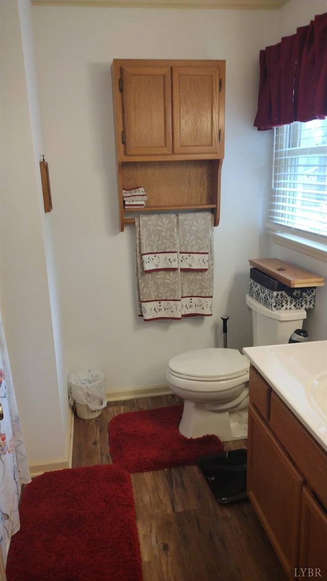 618 Prospect Rd, Hurt, VA 24563 - full bath with vanity, toilet, baseboards, and wood finished floors