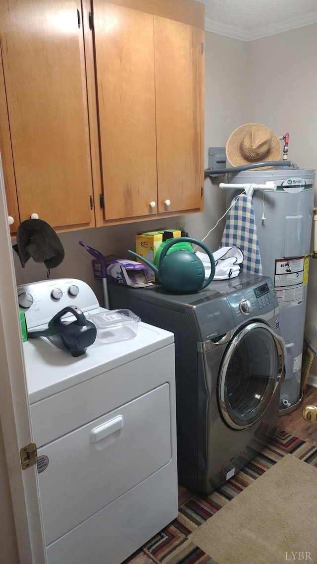 618 Prospect Rd, Hurt, VA 24563 - laundry room with cabinet space, crown molding, separate washer and dryer, and water heater